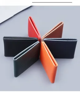 Flat lay of colorful genuine leather driver license covers in a circular arrangement