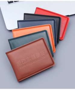 Close-up of genuine leather driver license covers in six assorted colors with stitching