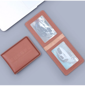 Close-up of brown leather driver license wallet showing dual clear PVC internal card slots