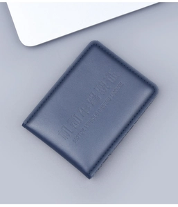Close-up of deep blue genuine leather driver's license cover with detailed stitching