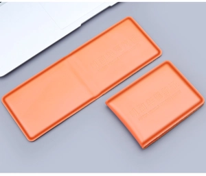 Detailed view of orange genuine leather driving license covers in fold and open styles