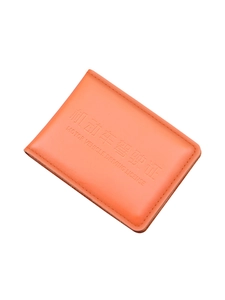 Orange genuine leather driver's license protector with embossed text on white background