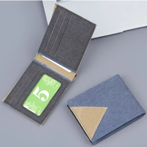 Detail view of denim canvas bifold wallet with multiple card slots and ID window