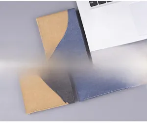 Detail of slim denim and leather wallets with color-block design and reinforced stitching