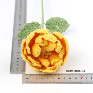 Handmade yellow crochet peony flower with green leaves and stem, 10cm diameter size