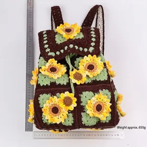 Handmade crochet sunflower backpack in dark brown with measurements and 650g weight