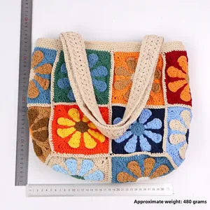 Detailed flat lay of colorful floral crochet tote bag with size measuring scale reference