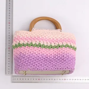 Handmade crochet handbag with purple pink gradient floral knit and resin handles