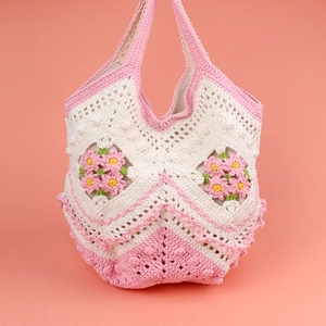 Handmade crochet tote bag with white and pink stripes and 3D flower decorations