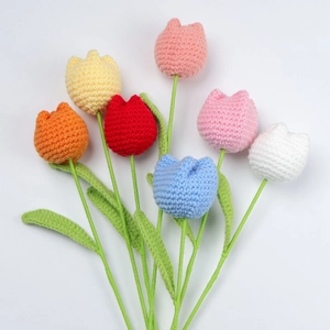 Close-up of handmade crochet tulip bouquet set with multi-color knitted flower petals