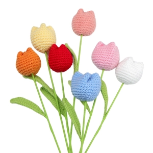 Set of 7 colorful handmade crochet tulips with vibrant knitted petals and green stems