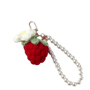 Handmade crochet strawberry keychain with white flower and faux pearl wristlet strap