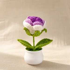 Handmade crochet rose potted plant in white ceramic pot for home and desk decoration