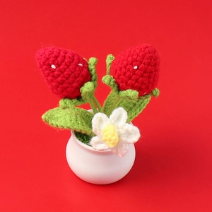 Handmade crochet strawberry potted plant with red yarn berries and ceramic base