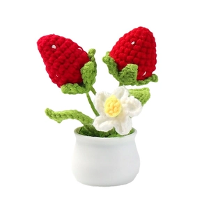 Handmade crochet strawberry potted plant ornament with red berries in white ceramic pot