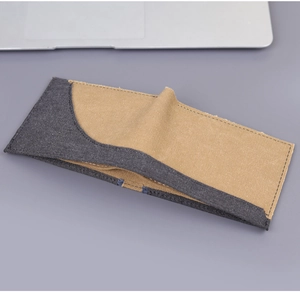 Detail of slim bi-fold canvas wallet in grey and khaki with precise contrast stitching