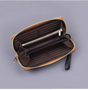 Detailed view of the men's long canvas wallet with 12 card slots and zippered pocket