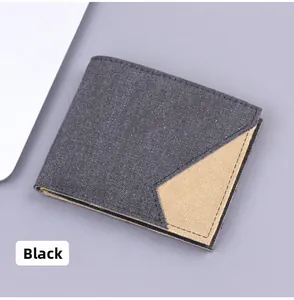 Close-up of black canvas bifold wallet featuring triangular khaki patchwork detail