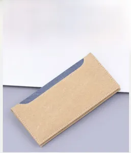 Detail view of the durable canvas long wallet in coffee with neat edge stitching