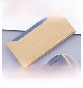 Detail of khaki canvas long wallet with blue stitching and dual-layer card slots