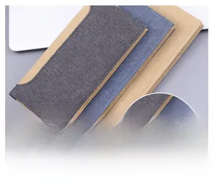 Detail showing high-quality stitching on canvas and denim long wallets in multiple colors