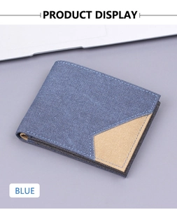 Detail of blue denim canvas wallet with beige patchwork and precise stitching