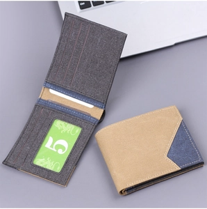 Detailed view of men's canvas bi-fold wallet featuring stylish color-block texture and slots