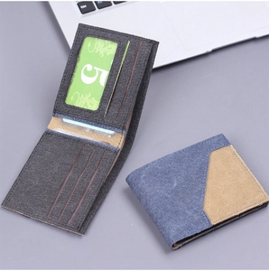 Detail view of canvas wallet showing 9 card slots and durable bi-fold stitch construction