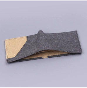 Detail of bifold canvas wallet with durable gray and khaki stitching and fabric texture