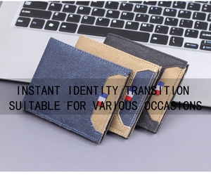 Macro detail of three-color canvas wallets with tri-color ribbon trim on a keyboard