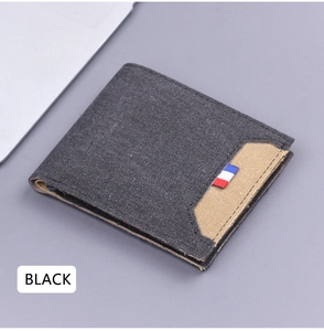 Detail of slim bifold canvas wallet for men featuring multi-slot card holder design