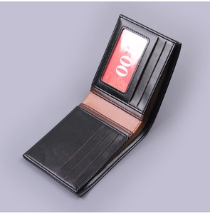 Detail view of bi-fold wallet interior featuring three card slots and clear ID window