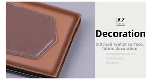 Close-up of dual-tone leather wallet featuring hexagonal patch and precise stitching details
