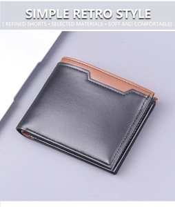 Detail of bifold wallet showing black leather with brown trim and neat stitching