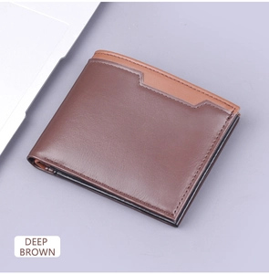 Detail of a deep brown bifold leather wallet for men featuring contrast light brown stitching