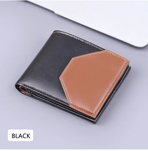 Detail view of a men's bifold wallet with black and brown geometric leather patchwork