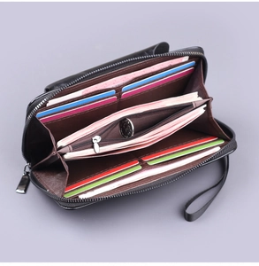 Internal view of a black leather long wallet with multi-card slots and coin pocket