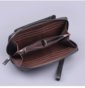 Detailed interior of long black clutch wallet showing multiple card slots and zipper compartment
