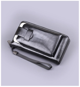 Detail of glossy black leather long clutch wallet featuring front smartphone compartment