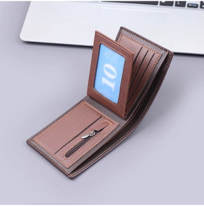 Detail view of brown leather wallet interior showing card slots and zipper pocket