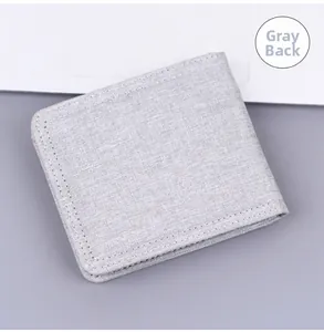 Detailed back view of a grey canvas short folding wallet showing woven texture and stitching