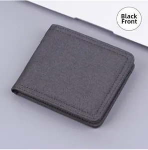 Front view of a minimalist black canvas bifold wallet with refined stitching details