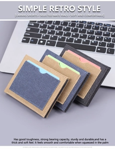 Detail of color-block canvas card wallets on a laptop highlighting soft durable textures