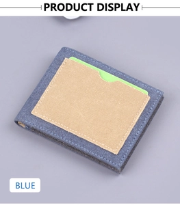 Detail of blue denim canvas bifold wallet featuring a beige card slot and functional design