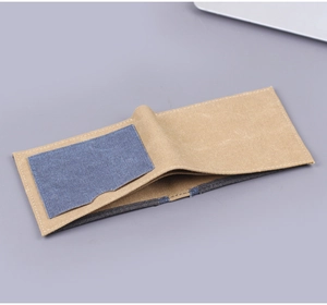 Detail view of khaki canvas wallet with a contrasting navy blue card slot inside