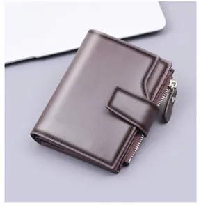 Detailed view of dark brown leather wallet showing side zipper pocket and snap closure
