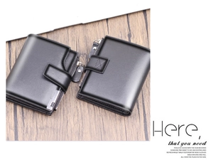 Vertical men's wallet with snap closure and side zipper detail on dark wood surface