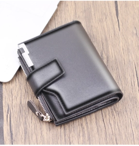 Close-up of black leather men's wallet with zipper pocket and snap button closure