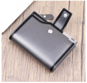 Close-up of black leather wallet showing metal snap button, side zipper and corner protector