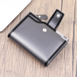 Vertical minimalist black leather wallet with metal snap closure and zipper pocket